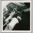 Man on ladder hammering (ddr-densho-426-2266)