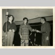 Three men at an auction (ddr-manz-6-15)