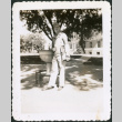 Man standing by drinking fountain (ddr-densho-434-457)