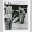 5th Explosives Ordnance Disposal Detachment moving bomb in Naha, Okinawa (ddr-densho-1007-86)