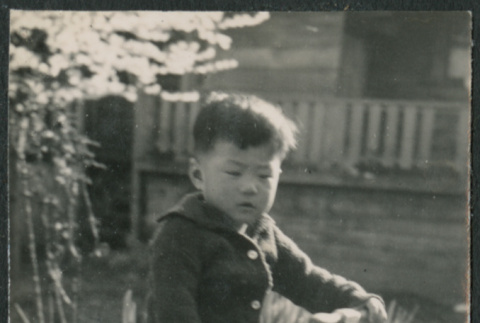 Boy on scooter (ddr-densho-523-119)