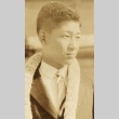 Young man wearing leis (ddr-njpa-4-2240)