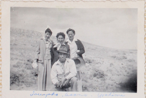 Three women and a man in field (ddr-densho-464-52)