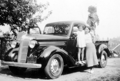 Woman and daughter in front of car (ddr-densho-2-20)