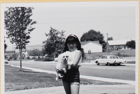Girl holding dog (ddr-densho-522-108)
