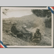 Three men sitting around a fire (ddr-densho-201-940)