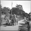 Two boys on pony ride (ddr-densho-426-963)