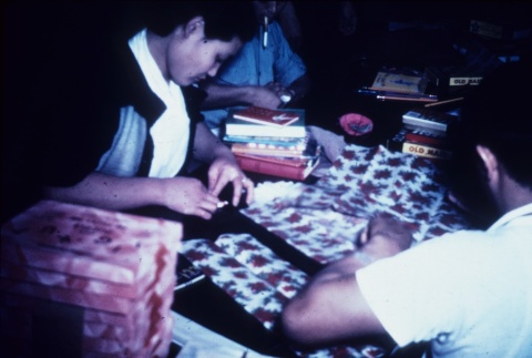 Incarcerees wrapping holiday gifts (ddr-densho-160-87)