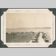 Line of cars and large group near shore (ddr-densho-316-292)