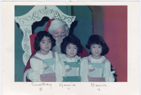 Christmas card with three children and Santa (ddr-densho-430-271)