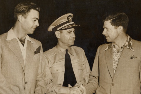 Men shaking hands, one in military dress (ddr-njpa-1-488)