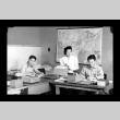N. Endo, Fumi Yoshimura, and I. Shirokawa in the Amache Co-op office (ddr-csujad-55-1546)