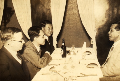Ikkaku Matsuzawa seated at a table with other men (ddr-njpa-4-909)