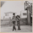 William Shiomi with unidentified boy eating apples (ddr-densho-522-283)