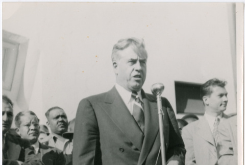 Man standing at microphone (ddr-densho-426-1056)