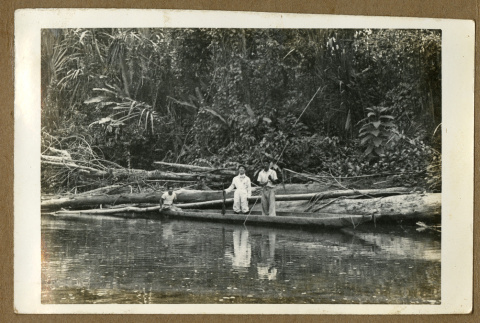 Japanese Peruvian men on a canoe (ddr-csujad-33-173)