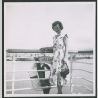 Nisei woman poses on board ship (ddr-densho-363-77)