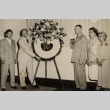A group of men and women with a standing flower spary (ddr-njpa-1-1148)