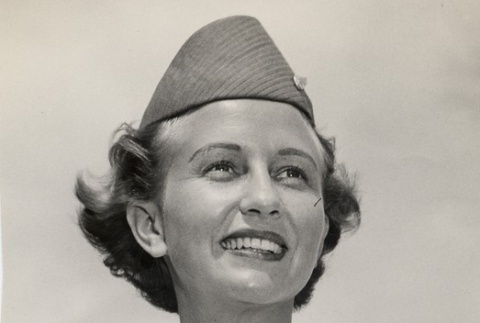 A woman in uniform wearing a lei (ddr-njpa-1-1268)