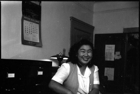 Woman seated by file cabinet (ddr-densho-426-952)