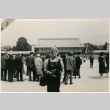 Woman with camera in courtyard (ddr-densho-426-1076)