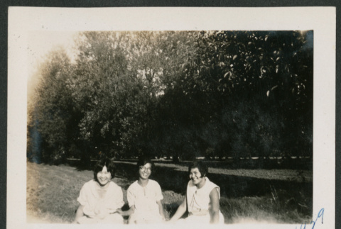 three women sitting on the ground (ddr-densho-378-621)