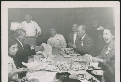 Group sitting around a table (ddr-densho-293-138)