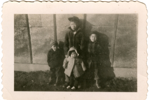 Four children standing outside barracks (ddr-densho-430-176)
