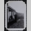 Man poses by porch (ddr-densho-359-1506)
