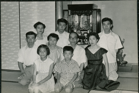 Family poses in front of shrine (ddr-densho-359-1143)