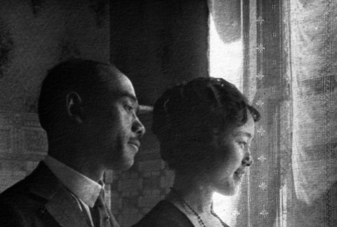 Couple posing by window (ddr-ajah-6-557)