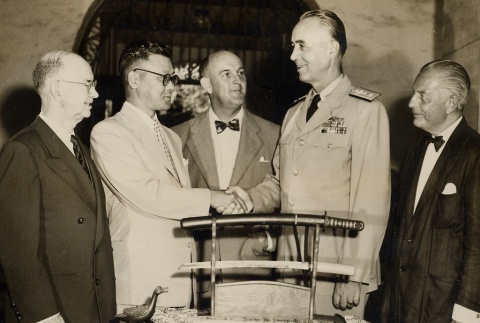 Stuart S. Murray shaking hands with the Japanese Consul-General at a ceremony (ddr-njpa-2-217)