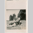 Man laying in field (ddr-densho-426-2449)