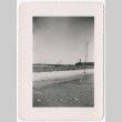 View of field with buildings in background (ddr-densho-329-1357)