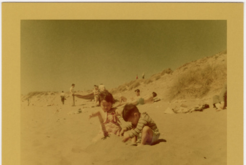 Two children playing on beach (ddr-densho-426-181)