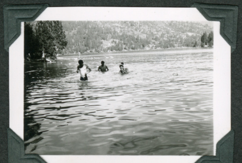 Three men swimming (ddr-densho-475-660)