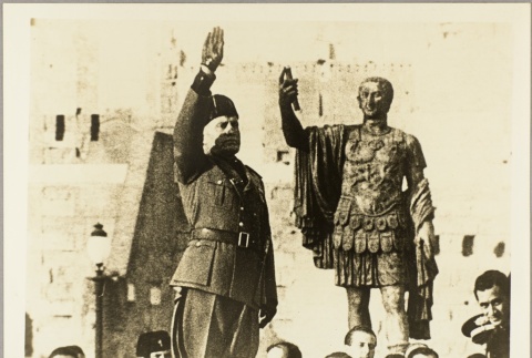Mussolini giving a salute next to a statue of Caesar (ddr-njpa-13-681)