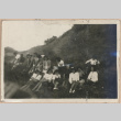 Young people sitting on a hillside (ddr-manz-10-3)