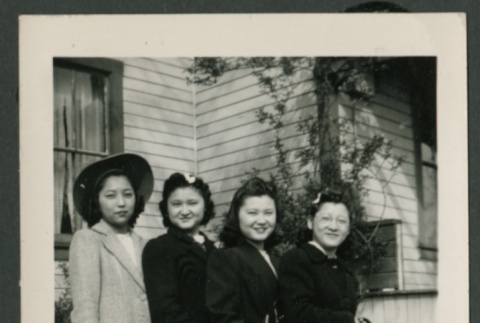 Four women pose outside of the house (ddr-densho-359-172)