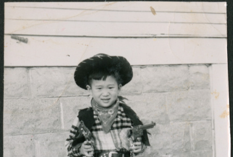 Boy in cowboy outfit (ddr-densho-523-253)