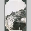 Man standing on hillside above tunnel (ddr-ajah-2-333)