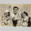 Babe Ruth posing with his daughter Julia and wife Claire, all wearing leis (ddr-njpa-1-1399)