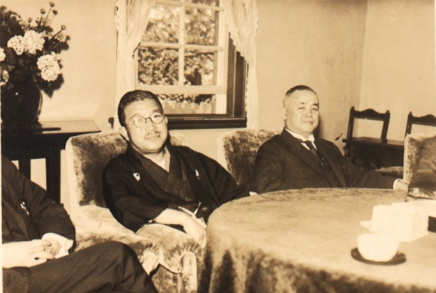 Men seated at a table (ddr-njpa-4-83)