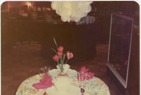 Photo of table setting with flowered tablecloth (ddr-densho-424-851)