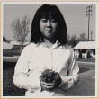Girl holding flower (ddr-densho-522-125)
