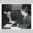 Nisei man signing enlistment papers (ddr-densho-122-758)
