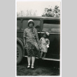 Woman and child next to car (ddr-densho-480-85)
