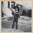 William Shiomi in cowboy costume with toy gun (ddr-densho-522-258)