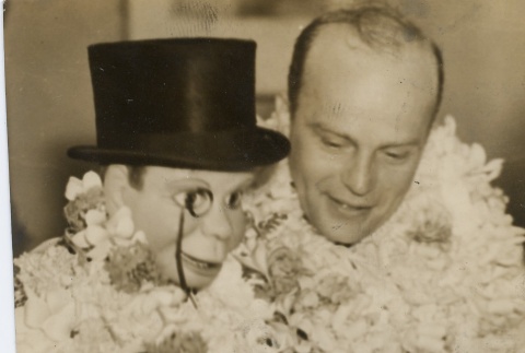 Edgar Bergen and his ventriloquist dummy, Charlie McCarthy, arriving in Hawai'i (ddr-njpa-1-963)