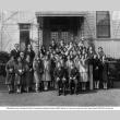 Group of mostly young women posing for photo outside building (ddr-ajah-3-173)